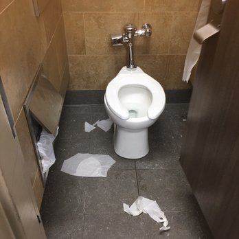 Pilot Travel Center - a toilet with toilet paper on the floor - Gas Stations Near Me - Bath, New York