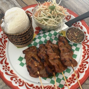 Saraya Thai Cuisine - Moo Ping BBQ pork satay, papaya salad. Sticky rice and a side of Crying tiger sauce - also fantastic! - Thai Near Me - Burbank, California Saraya Thai Cuisine - Moo Ping BBQ pork satay, papaya salad. Sticky rice and a side of Crying tiger sauce - also fantastic! - Thai Near Me - Burbank, California
