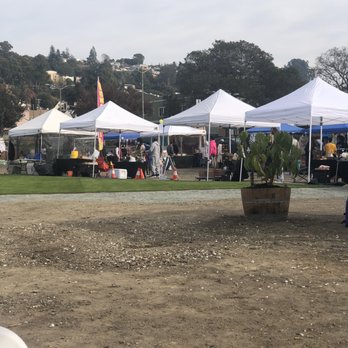 Liberation Park - Grass center surrounded by dirt lot (during outdoor market) - Community Service/Non-Profit Near Me - Oakland, California Liberation Park - Grass center surrounded by dirt lot (during outdoor market) - Community Service/Non-Profit Near Me - Oakland, California