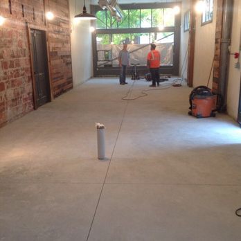 Elite Crete Systems - Prepping the concrete floor: sand, fill cracks, mask walls, shop vac all debris. - Masonry/Concrete Near Me Elite Crete Systems - Prepping the concrete floor: sand, fill cracks, mask walls, shop vac all debris. - Masonry/Concrete Near Me