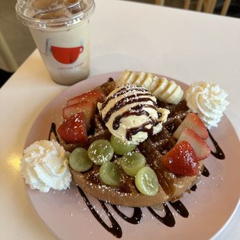 Fresh fruit waffle with iced strawberry latte