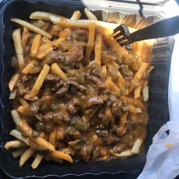 Smothered Green chile fries with steak !!