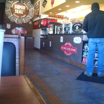 Jimmy John's - a man standing at the counter - Delis Near Me - Arnolds Park, Iowa Jimmy John's - a man standing at the counter - Delis Near Me - Arnolds Park, Iowa