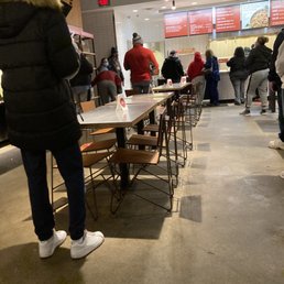 a line of people waiting to order food