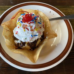 Primos Tex Mex Bar And Grill - Fried ice cream- ice cream rolled in corn flakes covered in chocolate syrup, whip cream and a cherry