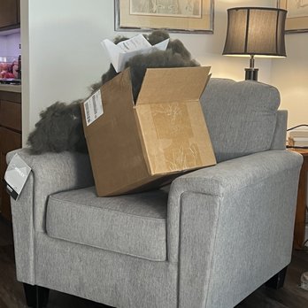 Ashley Store - Defective chair with a box of stuffing they sent to us to fix the chair. - Furniture Stores Near Me - Colton, California Ashley Store - Defective chair with a box of stuffing they sent to us to fix the chair. - Furniture Stores Near Me - Colton, California