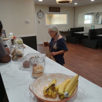B-Mocha Coffee Shop - a woman standing at a counter with a bowl of bananas - Coffee & Tea Near Me - Williamston, North Carolina B-Mocha Coffee Shop - a woman standing at a counter with a bowl of bananas - Coffee & Tea Near Me - Williamston, North Carolina