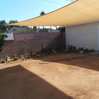 Hidden Gem Landscaping - Nice new shade sail over the happy plants. - Landscaping Near Me Hidden Gem Landscaping - Nice new shade sail over the happy plants. - Landscaping Near Me