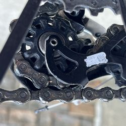 Jim's Bicycle Shop - New chain is rubbing on itself, it's too long!