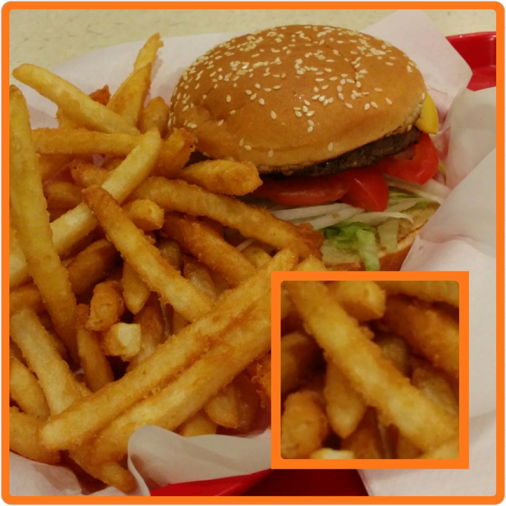 1/4 lb Cheeseburger & fries. Fries are covered with crispy bits. 1/4 lb Cheeseburger & fries. Fries are covered with crispy bits.