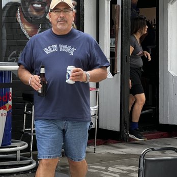 Stan's Sports Bar - a man walking down the street - Sports Bars Near Me - Bronx, New York Stan's Sports Bar - a man walking down the street - Sports Bars Near Me - Bronx, New York