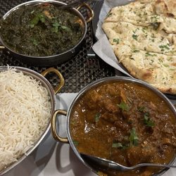 Dawat - This is the Chicken Tikka Saag and Karela Pepper Chicken with Garlic Naan and rice.