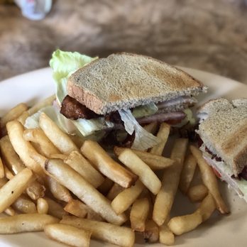 Sisters Restaurant - a sandwich and fries on a plate - American Near Me - Falconer, New York Sisters Restaurant - a sandwich and fries on a plate - American Near Me - Falconer, New York
