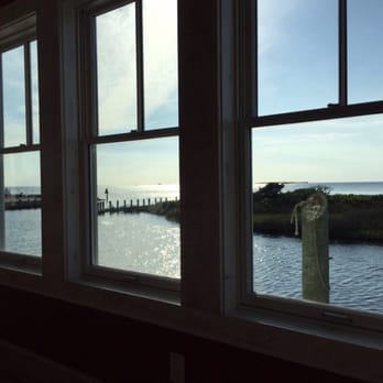 Hatteras Sol Waterside Grill - Table view, Hatteras Sol. New location at Teach's Lair Marina. - New American Near Me - Hatteras, North Carolina Hatteras Sol Waterside Grill - Table view, Hatteras Sol. New location at Teach's Lair Marina. - New American Near Me - Hatteras, North Carolina