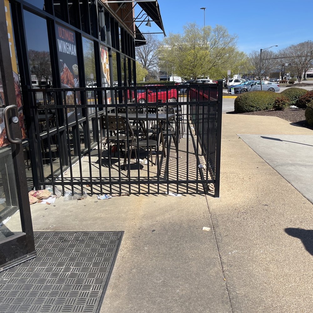 Smashburger - Trashy outdoor eating area, obviously an accumulation from days past - Burgers Near Me - Chesapeake, Virginia Smashburger - Trashy outdoor eating area, obviously an accumulation from days past - Burgers Near Me - Chesapeake, Virginia