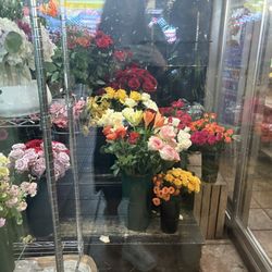 First Ave Florist - Glass box with flowers inside