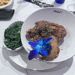 Fried chicken and steamed spinach with garlic.