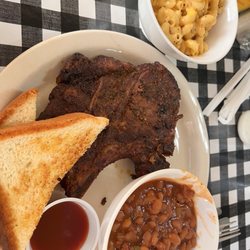 Jessie Chisholm’s Chuckwagon - Pork chop with baked beans and Mac n cheese