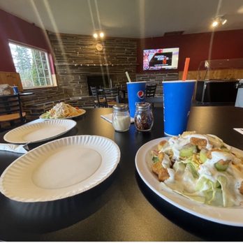 Knappa Pizza and Bar - two plates of food on a table - Pizza Near Me - Astoria, Oregon Knappa Pizza and Bar - two plates of food on a table - Pizza Near Me - Astoria, Oregon