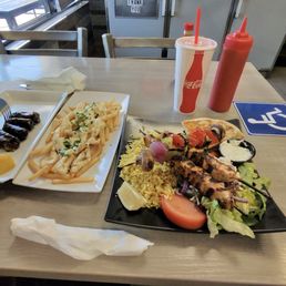 Chicken Kalamaki plate, garlic fries, dolmades.