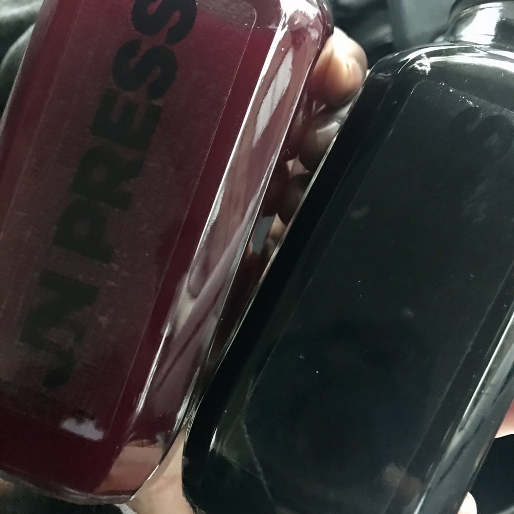 a person holding a bottle of juice