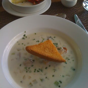 Cafe G - Oyster Stew and Marinated Artichoke Hearts salad with roasted red pepper (background) - New American Near Me - Boston, Massachusetts