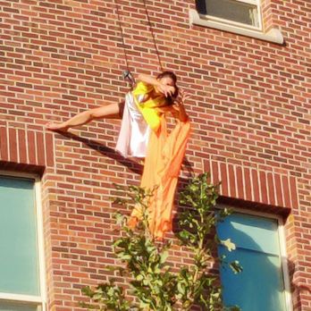 Newman Center For the Performing Arts - Dancers dancing on the side of the wall - Performing Arts Near Me - Denver, Colorado