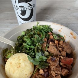 Brazilian stew on romaine and collard greens