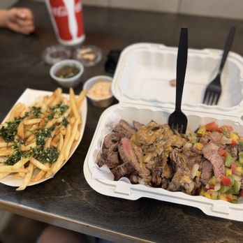Asado Gaucho - Gaucho Sampler comes with a side of fries, and I put the chimichurri on the side - Argentine Near Me - San Diego, California Asado Gaucho - Gaucho Sampler comes with a side of fries, and I put the chimichurri on the side - Argentine Near Me - San Diego, California