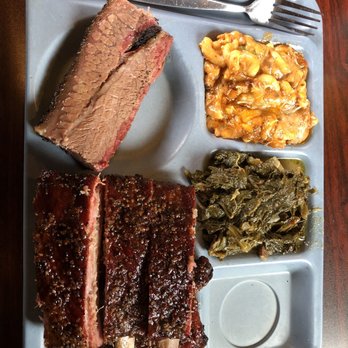 The Slow Bone - 1/4 lb of prime brisket, half rack of ribs, chili Mac, and collard greens. - Barbeque Near Me - Dallas, Texas The Slow Bone - 1/4 lb of prime brisket, half rack of ribs, chili Mac, and collard greens. - Barbeque Near Me - Dallas, Texas