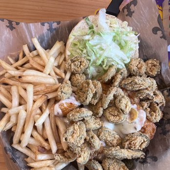 Rusty Pelican - This is by far the best Buffalo shrimp I have had. It's cooked just right very saucy and they put it on bun & add all the fixings. - Seafood Near Me - Covington, Louisiana