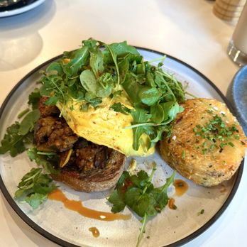 Two Hands - SEASONAL SCRAMBLE soft ribboned eggs,* eggplant and tomato kasundi on toasted sourdough, cilantro salad, paprika oil - Australian Near Me - Denver, Colorado