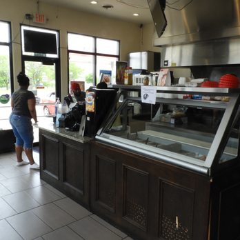 Gyro Hut - a woman standing at a counter in a restaurant - Fast Food Near Me - Waterloo, Iowa Gyro Hut - a woman standing at a counter in a restaurant - Fast Food Near Me - Waterloo, Iowa