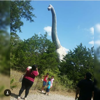 Dinosaur Park - Tia lilly near the biggest dino - Amusement Parks Near Me - Cedar Creek, Texas