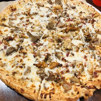 Uncle Maddio's Pizza Joint - This was a custom order pizza with white sauce, sausage, bacon, and extra cheese. - Pizza Near Me - Huntersville, North Carolina Uncle Maddio's Pizza Joint - This was a custom order pizza with white sauce, sausage, bacon, and extra cheese. - Pizza Near Me - Huntersville, North Carolina