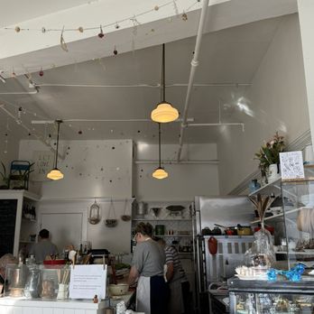 Maurice - The tasteful and airy space is cozy and feels like amlitte hidden Parisian cafe - French Near Me - Portland, Oregon