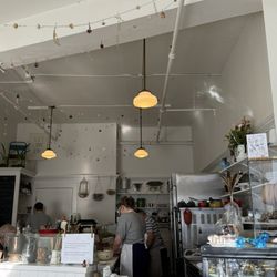 The tasteful and airy space is cozy and feels like amlitte hidden Parisian cafe