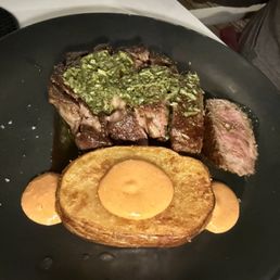 Steak medium rare with potato.