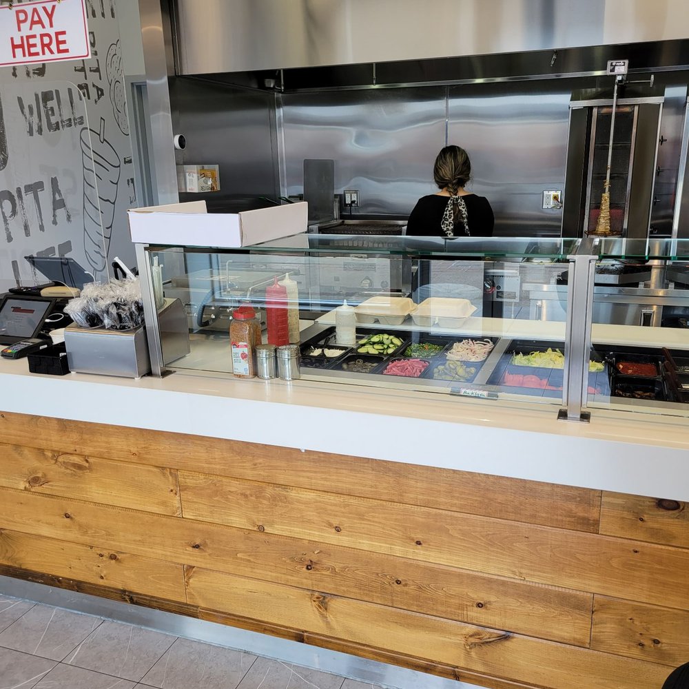 Pita Lite - a woman behind a counter - Mediterranean Near Me - Vaughan, Ontario Pita Lite - a woman behind a counter - Mediterranean Near Me - Vaughan, Ontario