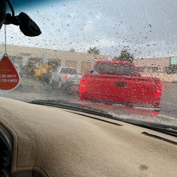 ADEQ Vehicle Emission Testing Station - Thought I'd get out of the wait with the rain. No such luck. Looking forward to selling this beast and only having my Tesla! No emissions!!