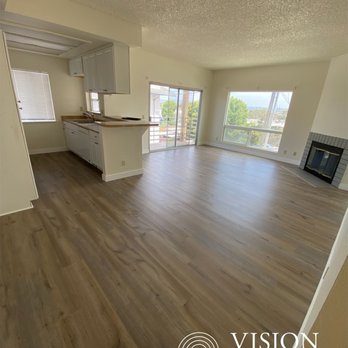 Vision Carpet - an empty living room with hardwood floors - Flooring Near Me - San Diego, California Vision Carpet - an empty living room with hardwood floors - Flooring Near Me - San Diego, California
