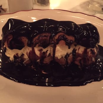 Le Diplomate - Profiteroles with vanilla ice cream, banana and then at the table they pour over the chocolate - Brasseries Near Me - Washington, DC, District of Columbia