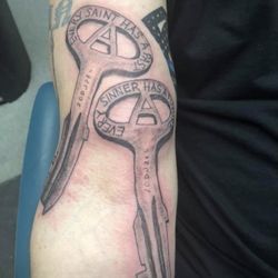 GoatHead Grafix - Two jail keys, every saint has a past every sinner has a future. Artwork by Kevin Graf of Goathead Graffix tattoo.