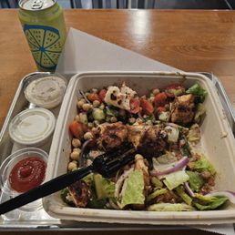 Plate, grilled saffron chicken tenderloin, hot honey chicken but has already been deleted, chickpea salad and Ceasars crunch salad. Plate, grilled saffron chicken tenderloin, hot honey chicken but has already been deleted, chickpea salad and Ceasars crunch salad.
