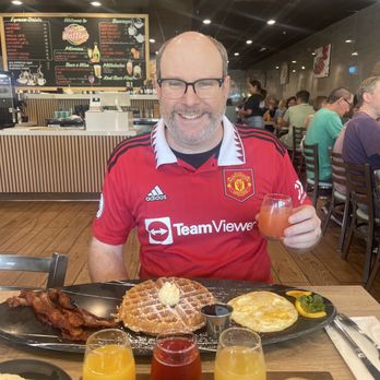 Eggs & Waffles - Big breakfast with Belgian waffle and mimosa flight (grapefruit, pineapple, pomegranate and orange). - Breakfast & Brunch Near Me - Gilroy, California