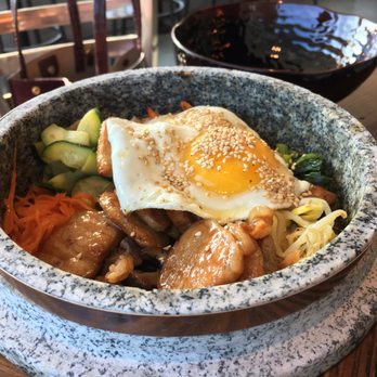 Burning Rice - Kimchi rice and garlic pork in a stone pot - Korean Near Me - Frisco, Texas Burning Rice - Kimchi rice and garlic pork in a stone pot - Korean Near Me - Frisco, Texas