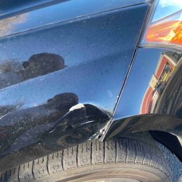 Right front fender with dent.
