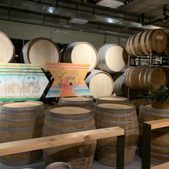 primitive beer - barrels stacked on top of each other - Beer Bar Near Me - Longmont, Colorado