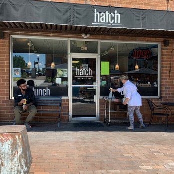 Hatch Sandwich Bar - two men eating outside - American Near Me - Hickory, North Carolina Hatch Sandwich Bar - two men eating outside - American Near Me - Hickory, North Carolina