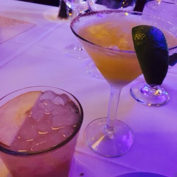 Ocean Prime - Left: pear and grapefruit fizz right: tequila cocktail on dry ice - Seafood Near Me - Denver, Colorado